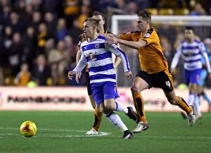 Wolves v Reading - Sky Bet Championship - Molineux Collection: Wolves vs. Reading: Intense Battle Between Dave Edwards and Matej Vydra in the Sky Bet