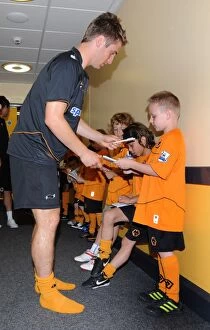 Images Dated 7th August 2011: Wolves vs. Zaragoza: A Tunnel Showdown of Matchday Mascots - Clash of the Wolves